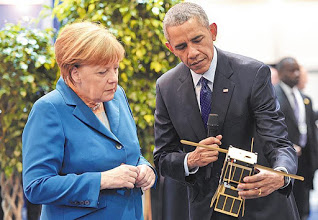 The T-LogoQube Engineering Model, held and discussed by Former President Barack Obama and German Chancellor Angela Merkel in Hanover Messe.